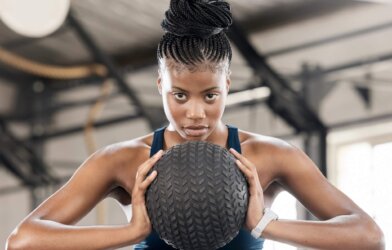 A woman working out with a medicine ball