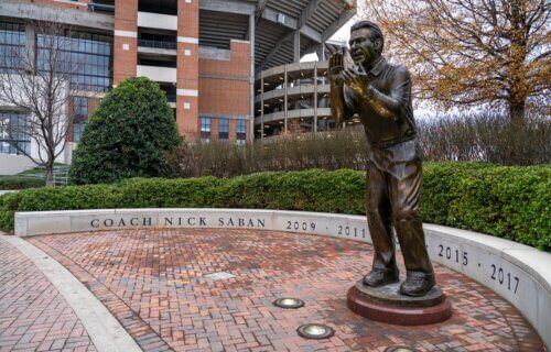 A statue of legendary NCAA football coach Nick Saban outside of Bryant-Denny Stadium on the campus of The University of Alabama
