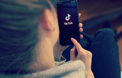 Tiktok on woman's Smart Phone Screen