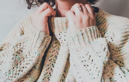 A woman wearing a knit sweater