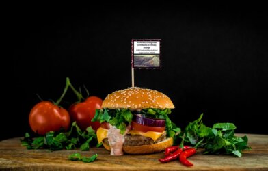 Climate warning label on a burger.