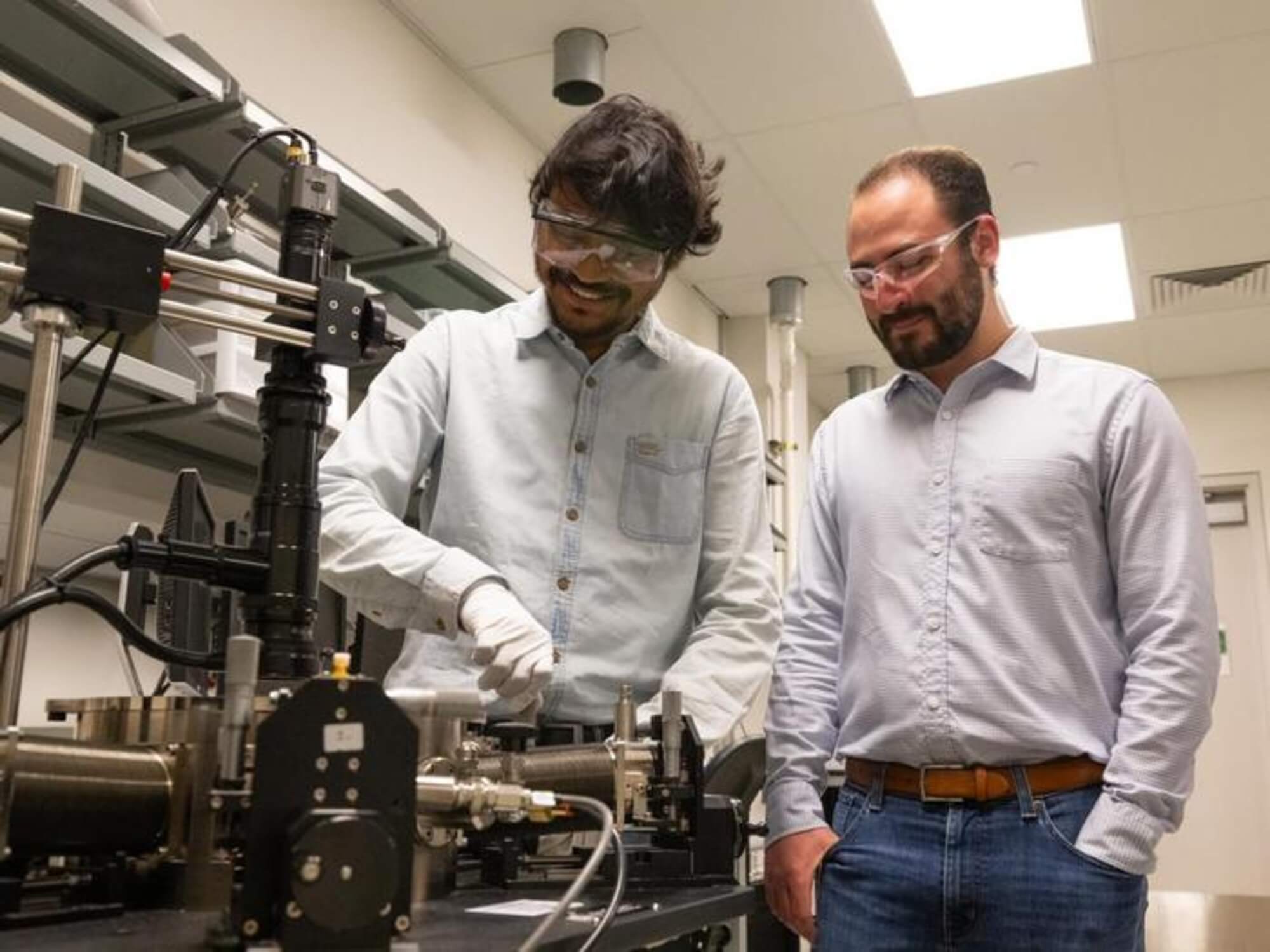 Subir Ghosh, doctoral student in engineering science and mechanics, left, and Andrew Pannone, graduate research assistant in engineering science and mechanics, at work in a lab in the Millennium Science Complex on Penn State's University Park campus