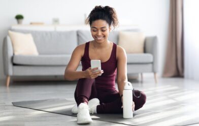 A woman using a fitness app