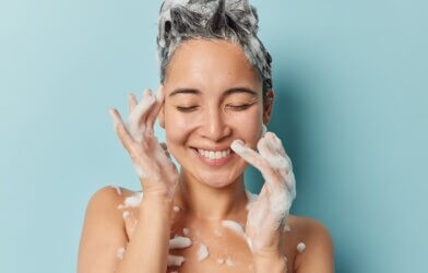 A woman shampooing her hair