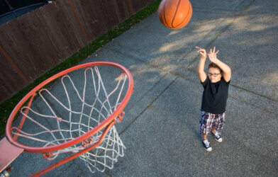 A child playing basketball