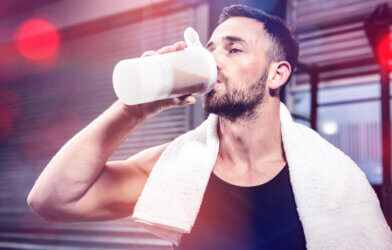A man drinking a protein shake after a workout