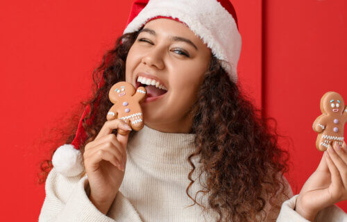 young woman eating gingerbread