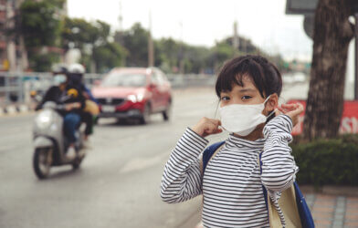 girl wearing protection mask to against air smog