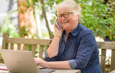 A senior woman on a laptop