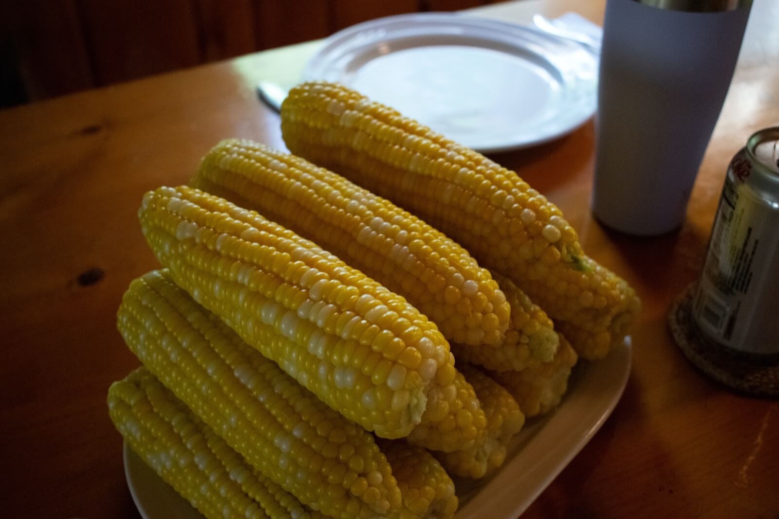A plate of boiled corn on the cob