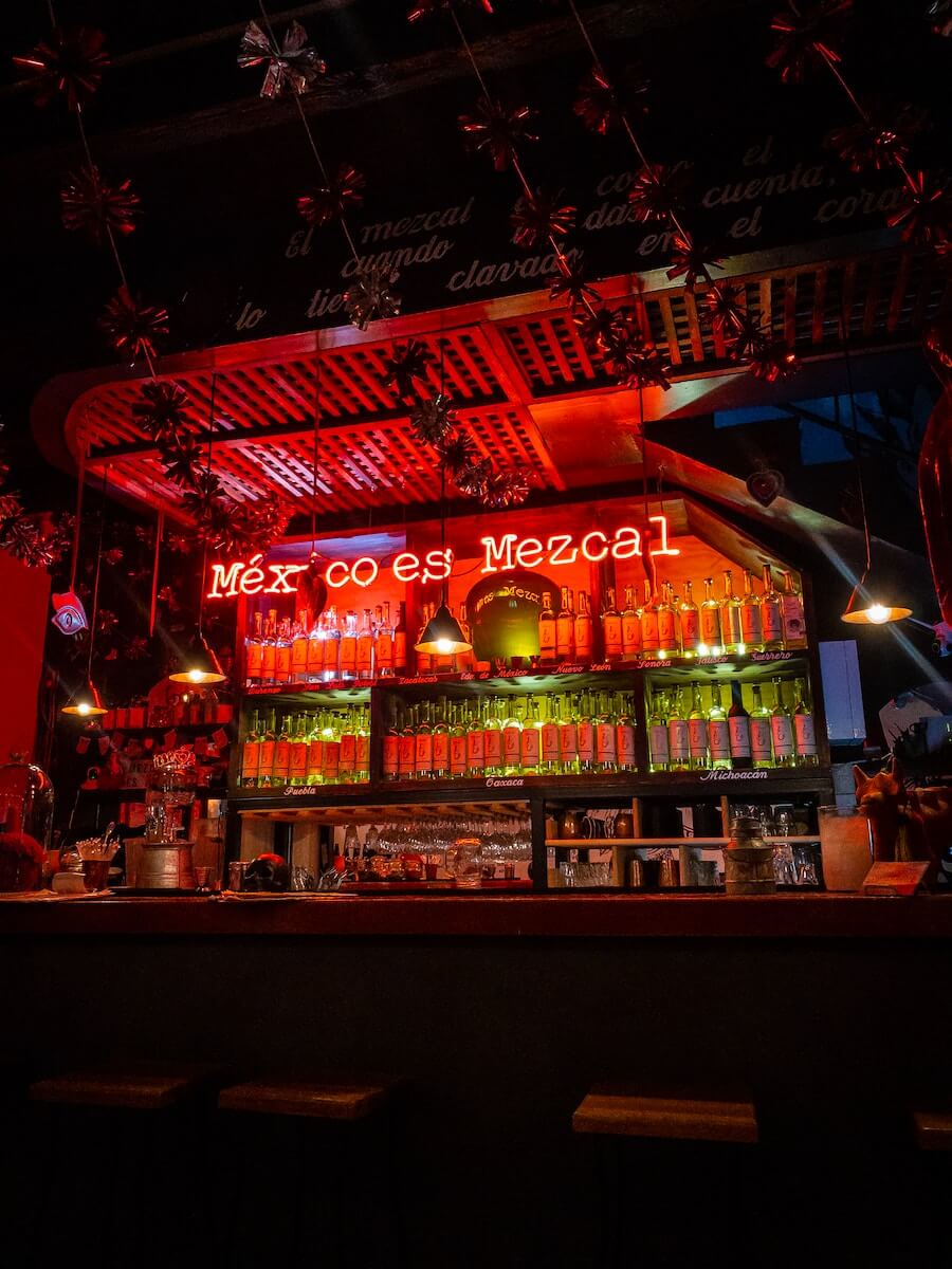 Red and yellow led signage that reads "Mexico Es Mezcal" photo by Marlon Michelle Corado on Unsplash
