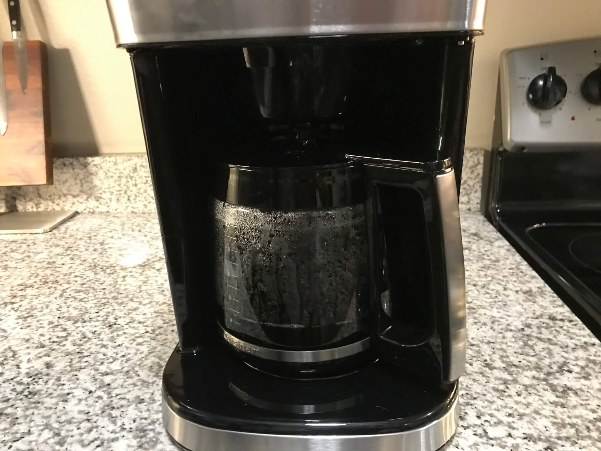 https://studyfinds.org/wp-content/uploads/2023/12/Cuisinart-DGB-800-Fully-Automatic-Burr-Grind-Brew-12-Cup-Glass-in-use-scaled.jpeg