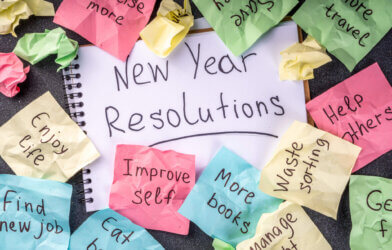 New year goals or resolutions on bright colorful paper stickers.