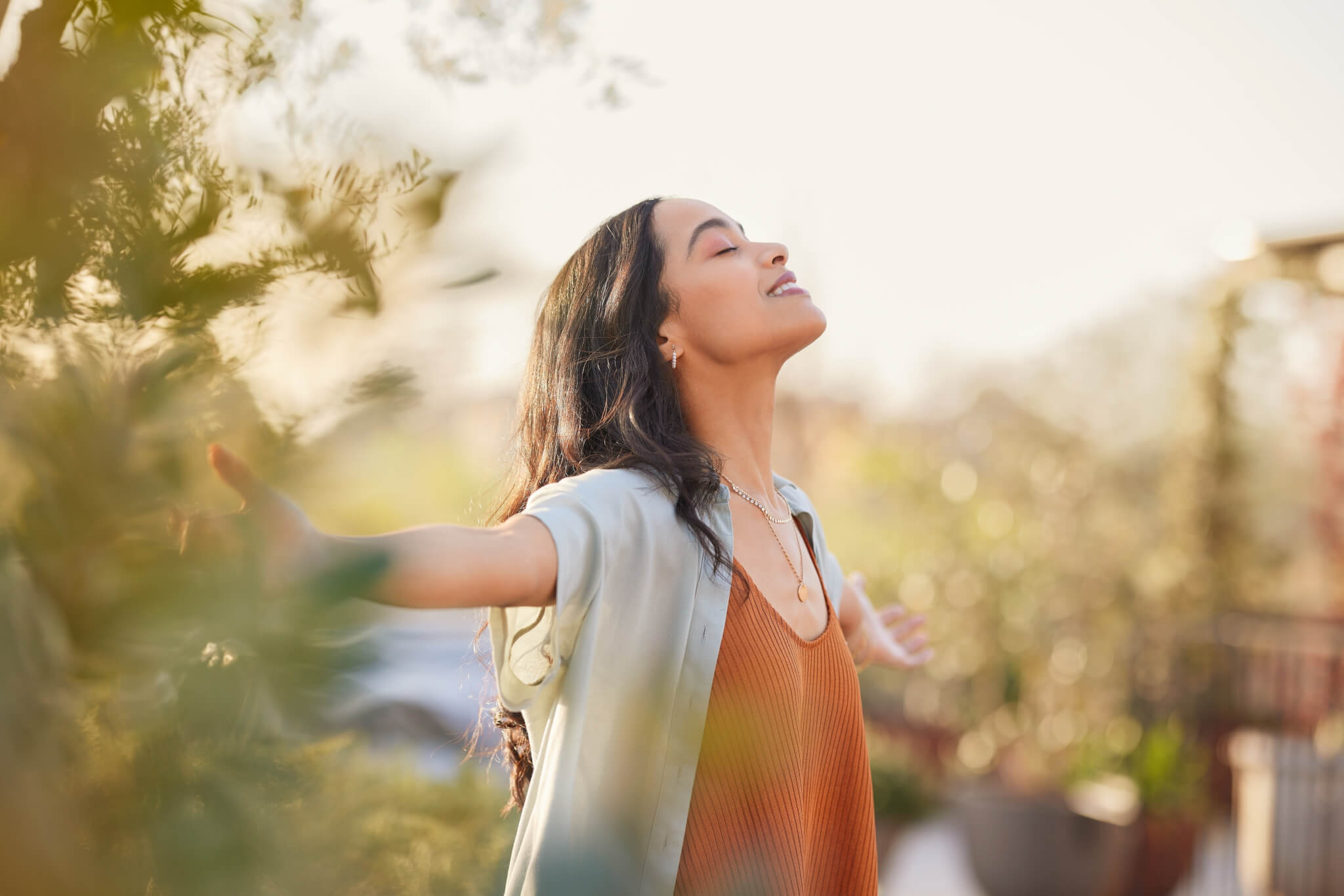 Woman practicing mindfulness or getting breath of fresh air outside