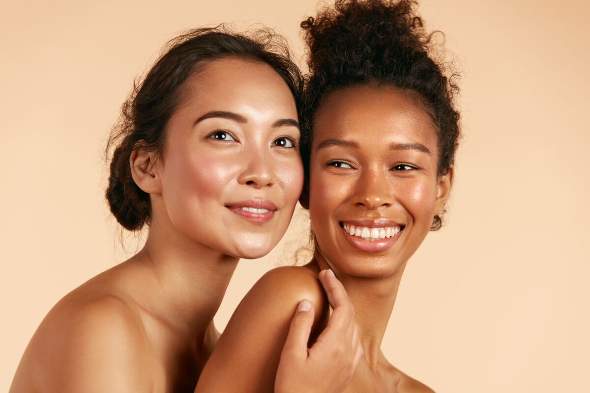 Two women with glowing skin