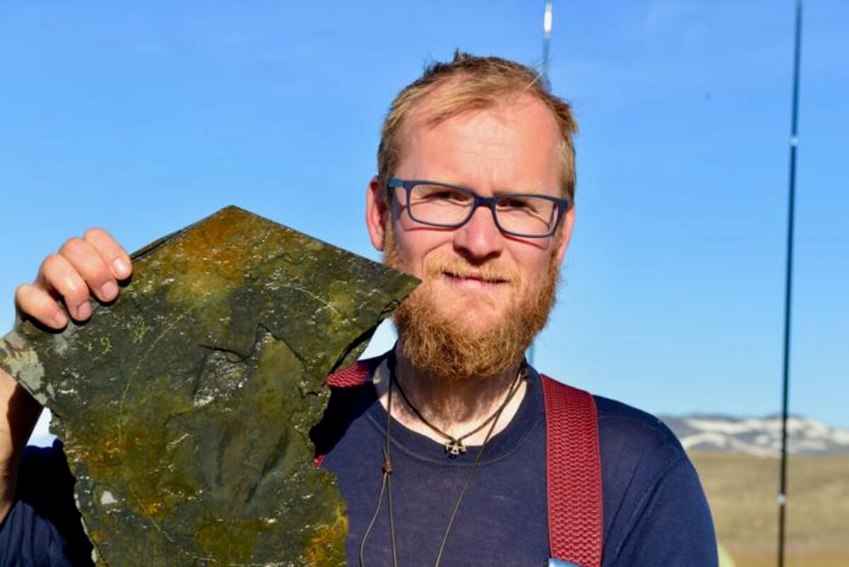 Dr. Jakob Vinther at the Sirius Passet locality in 2017 showing the largest specimen of Timorebestia after it was found