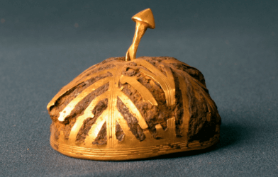 Hollow iron hemisphere covered with gold sheets.