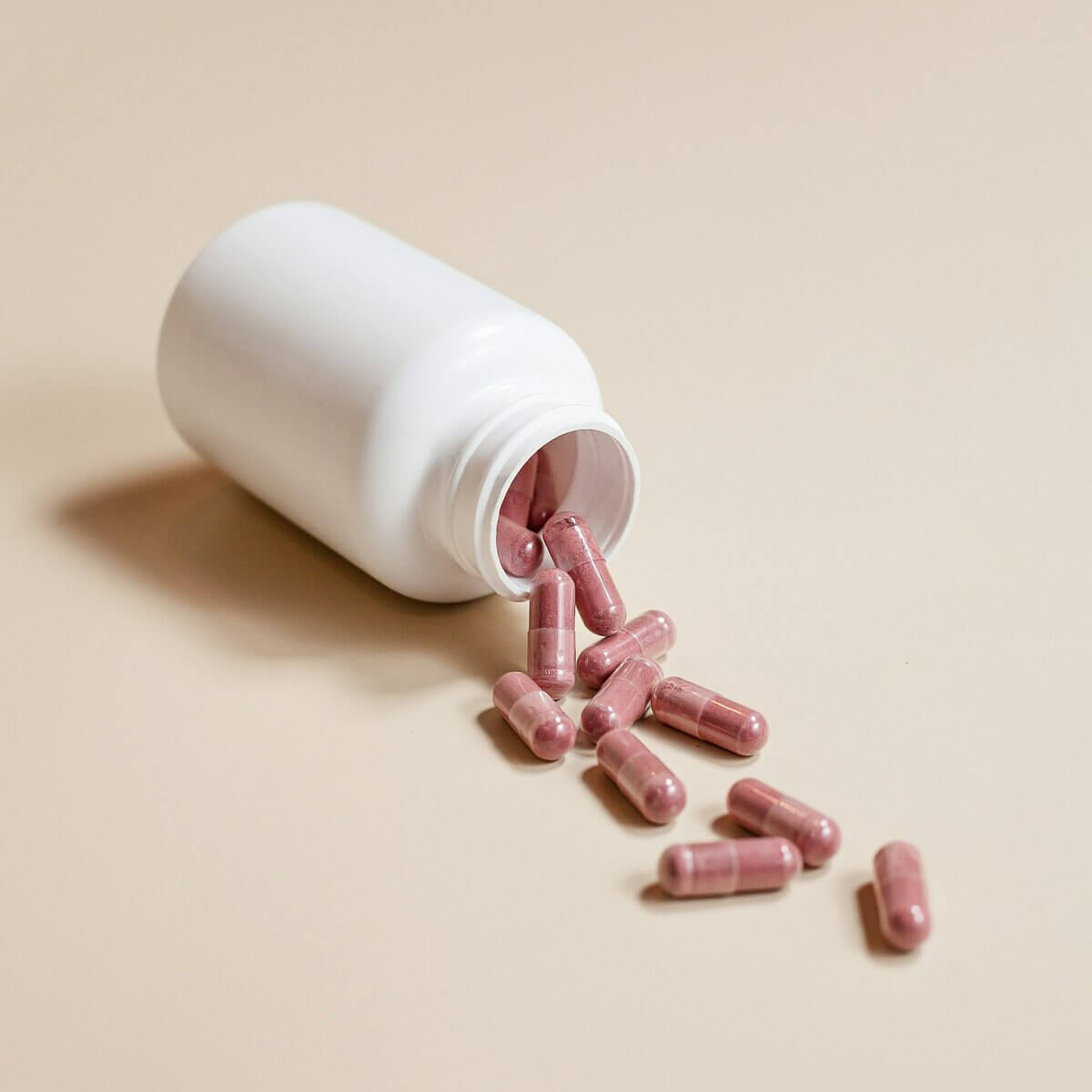 Red supplement capsules