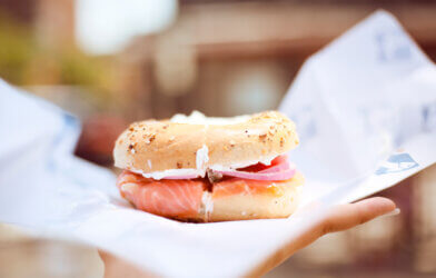 A New York-style bagel with lox, onions, and cream cheese