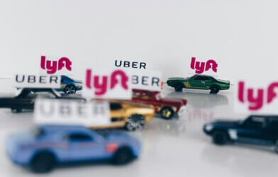 Rideshare vehicles: Cars with Uber and Lyft markers on them