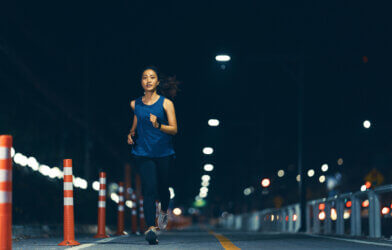 Woman running and exercising at night
