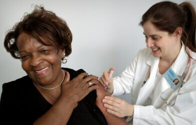 woman getting vaccine shot