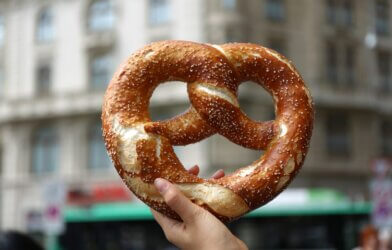 person holding pretzel