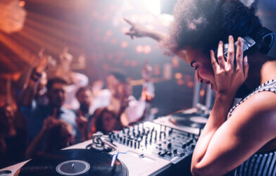 A DJ performing a set at a club