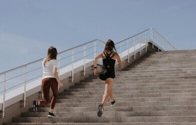 Women Running up Stairs