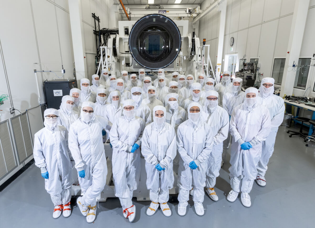 Most of the LSST Camera team photographed in the clean room with the finished camera at SLAC National Accelerator Laboratory, California. 