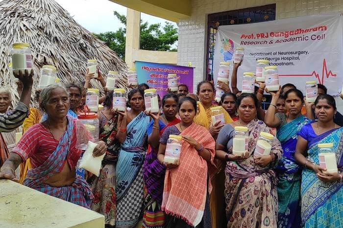 The participants of an international study on the effectiveness of adding folic acid to iodized table salt in the prevention of serious birth defects hold containers of the fortified salt they received as part of the study.