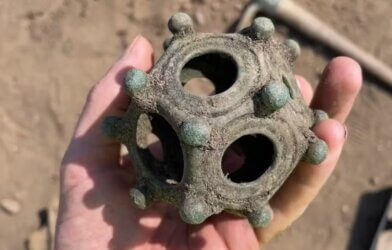 The newly discovered dodecahedron photographed during the dig.