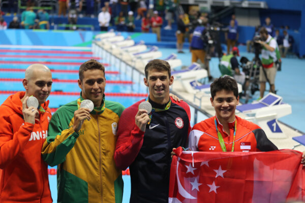 RIO DE JANEIRO, BRAZIL - AUGUST 12, 2016: Laszlo Cseh HUN (L), Chad le Clos RSA , Michael Phelps USA and Joseph Schooling SGP during medal ceremony after Men's 100m butterfly of the Rio 2016 Olympics